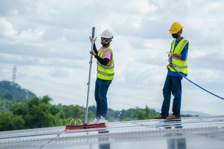 Technicians are cleaning solar panel,Clean solar panel in solar power plant.
